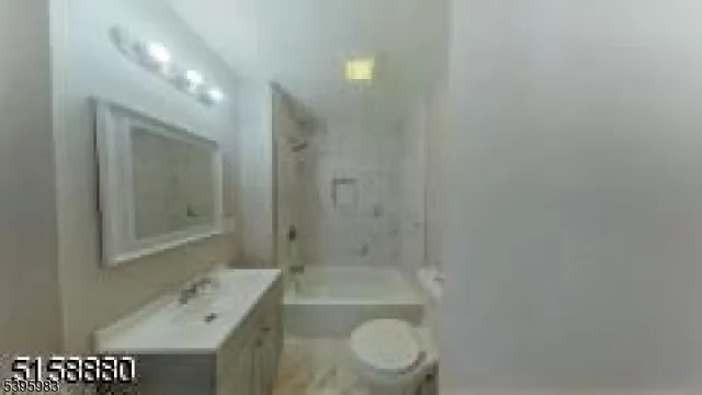 a bathroom with a shower a toilet and sink