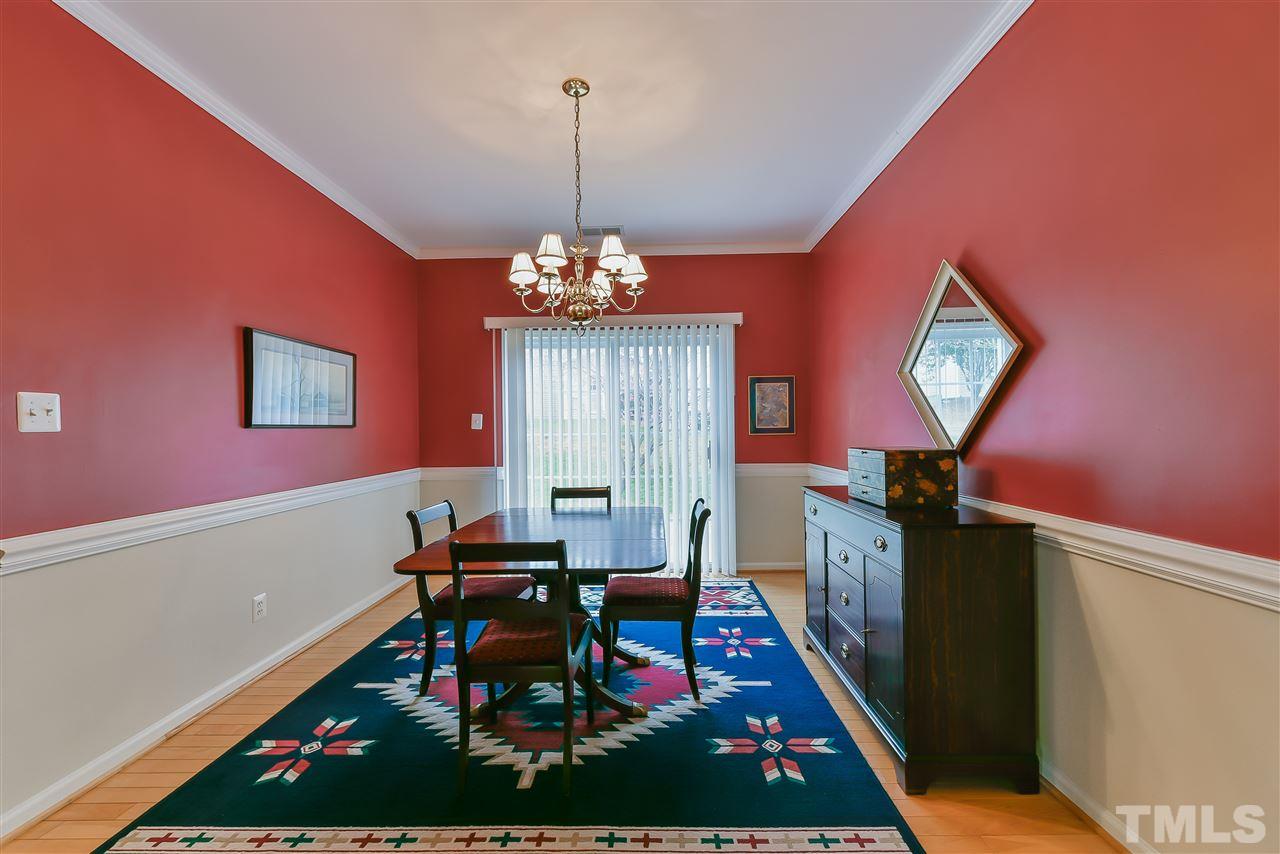 5312 Eolian Court Raleigh, NC 27607 - Photo 3 of 9 a living room with furniture and a chandelier