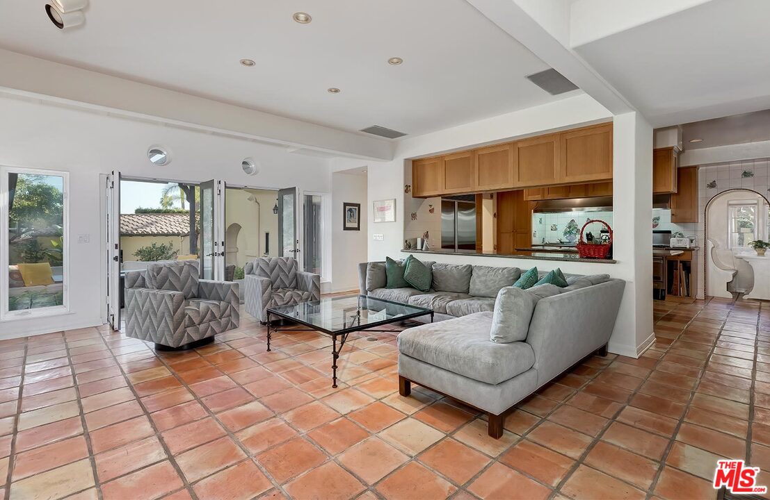 1130 Tower Road Beverly Hills, CA 90210 - Photo 12 of 30 a living room with furniture and a fireplace