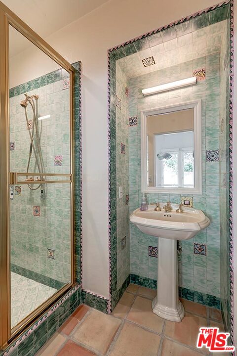 1130 Tower Road Beverly Hills, CA 90210 - Photo 14 of 30 a bathroom with a sink and a mirror