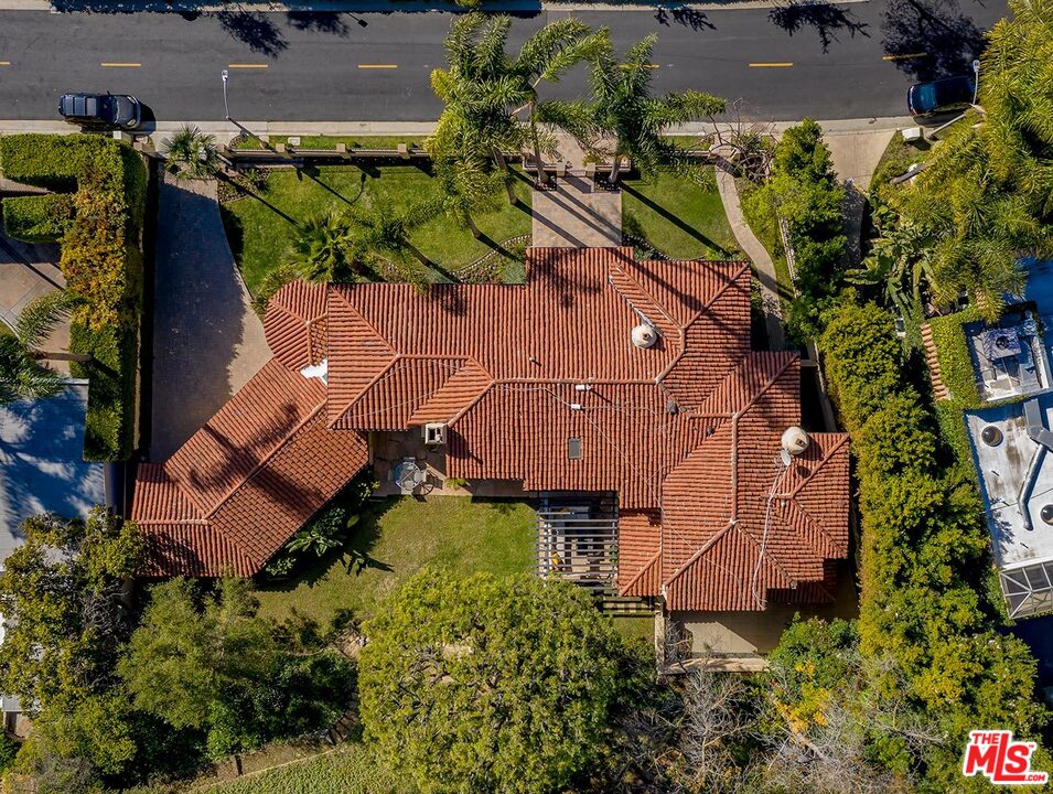 1130 Tower Road Beverly Hills, CA 90210 - Photo 3 of 30 an aerial view of a house with a yard
