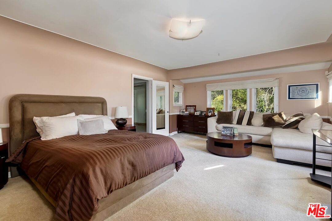 1130 Tower Road Beverly Hills, CA 90210 - Photo 24 of 30 a bedroom with bed couch and window