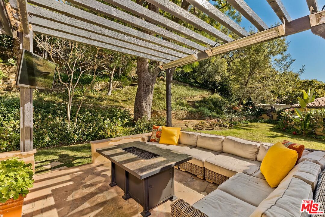 1130 Tower Road Beverly Hills, CA 90210 - Photo 28 of 30 a view of a patio with swimming pool