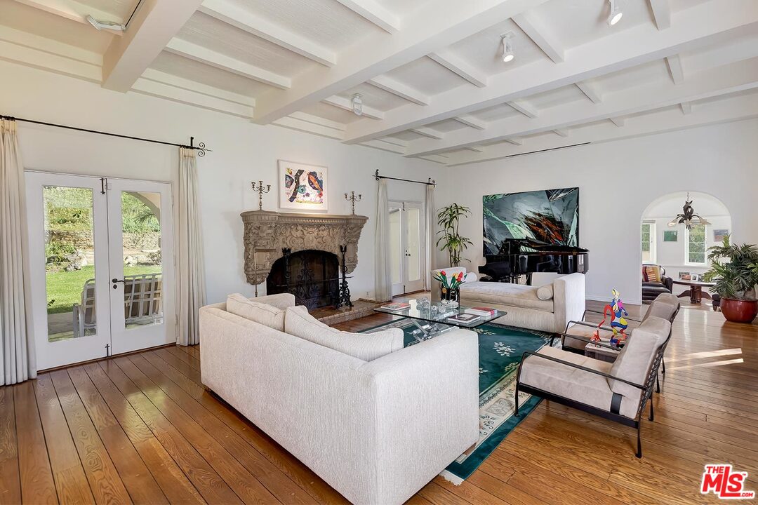 1130 Tower Road Beverly Hills, CA 90210 - Photo 5 of 30 a living room with furniture and a fireplace