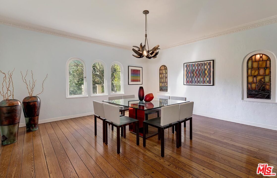 1130 Tower Road Beverly Hills, CA 90210 - Photo 7 of 30 a view of a dining room with furniture window and wooden floor