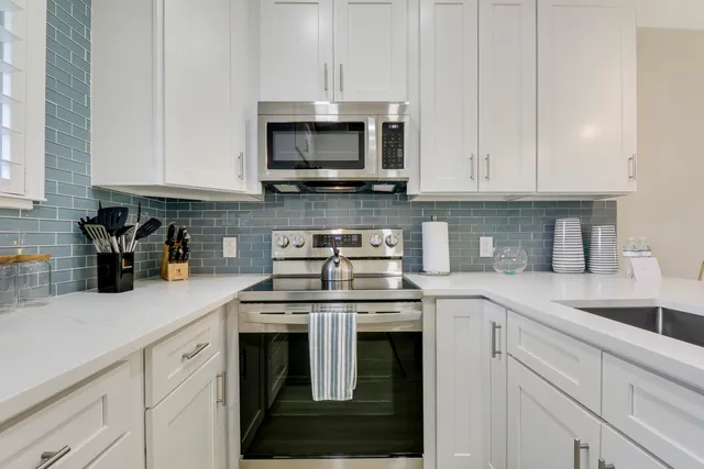 a view with a sink and cabinets