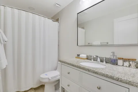 a bedroom with two beds and a window