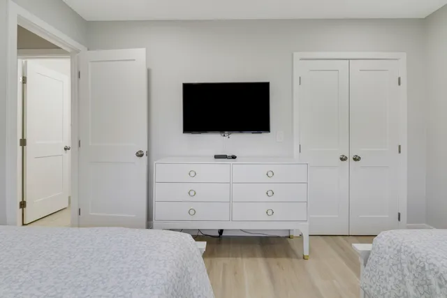 a bathroom with a toilet and a mirror