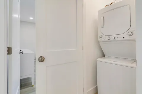 a front view of house with yard and outdoor seating