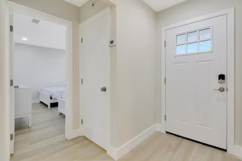 a dining room with furniture and wooden floor