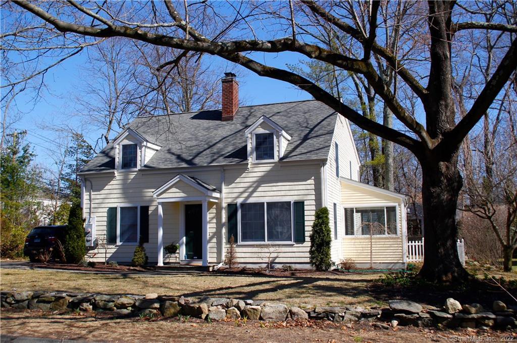 71 Merriman Road Stamford, CT 06905 - Photo 1 of 1 a view of a white house with large windows next to a road