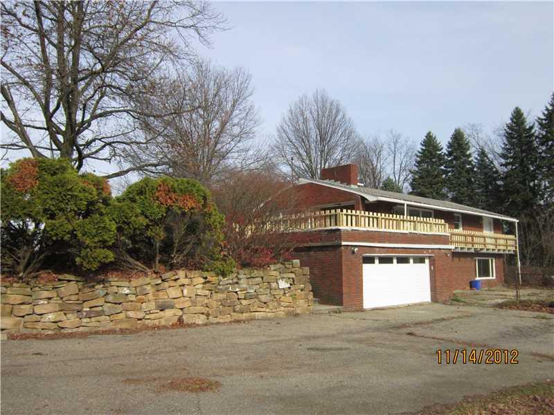 647 C Pittsburgh Road New Brighton, PA 15066 - Photo 3 of 12 Exterior Front. Rear of house, garage and parking area.