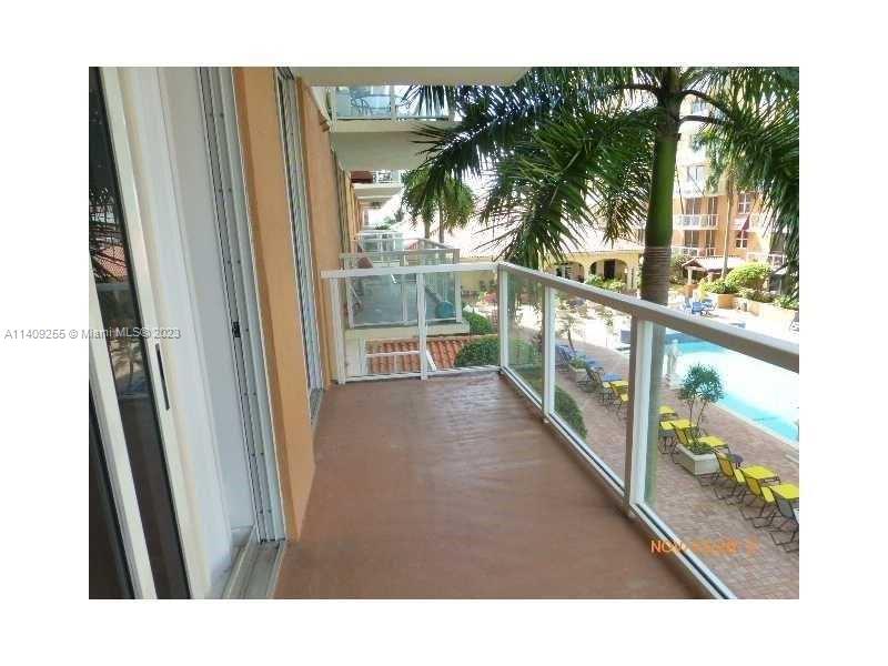 Miami Miami, FL 33126 - Photo 11 of 18 a view of a living room and a balcony