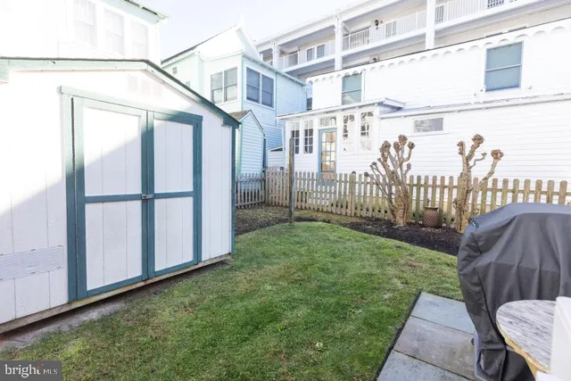 a house with potted plants in front of door