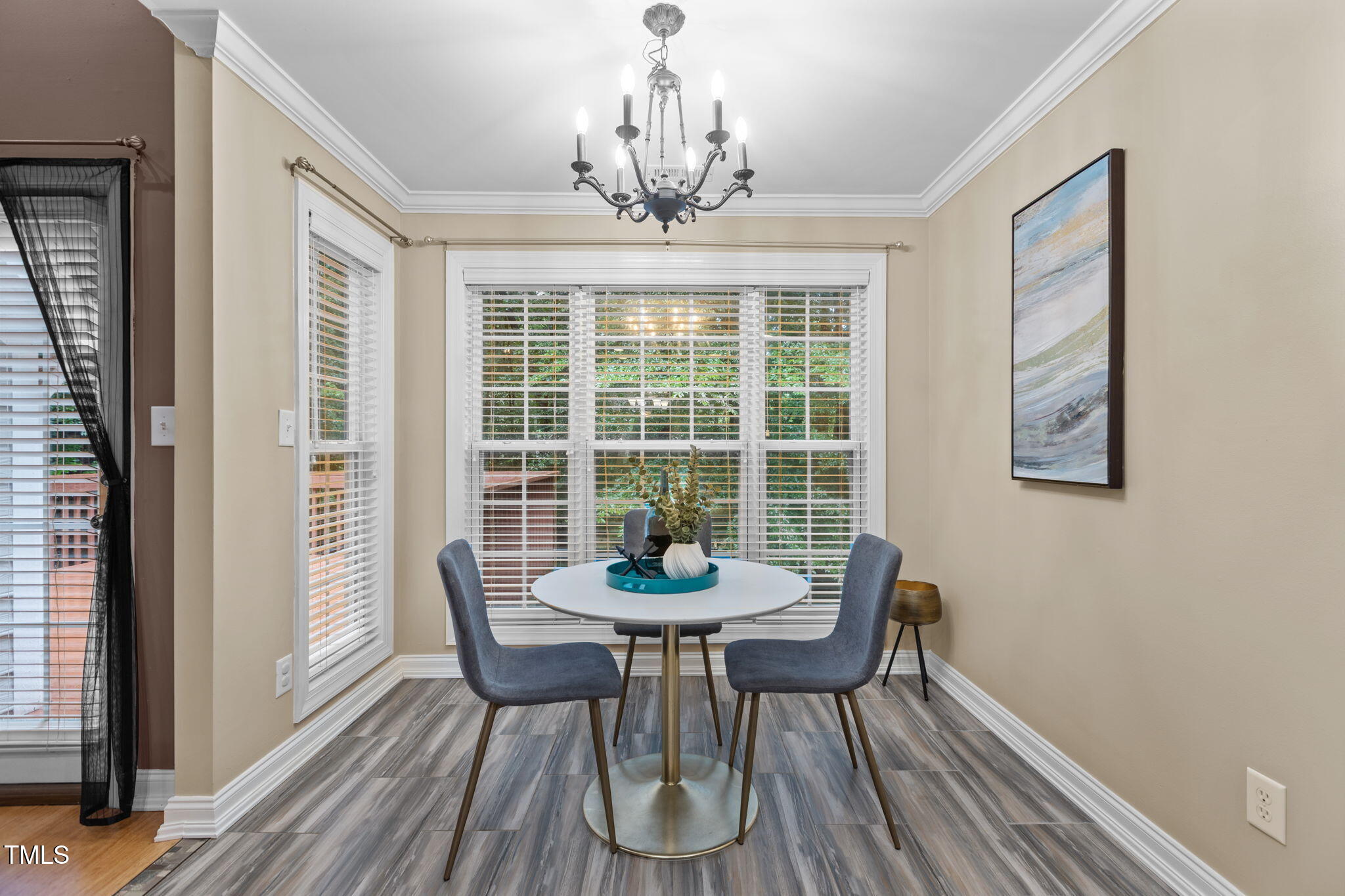 61 Fork Junction Road Timberlake, NC 27583 - Photo 17 of 59 a dining room with furniture a chandelier and wooden floor