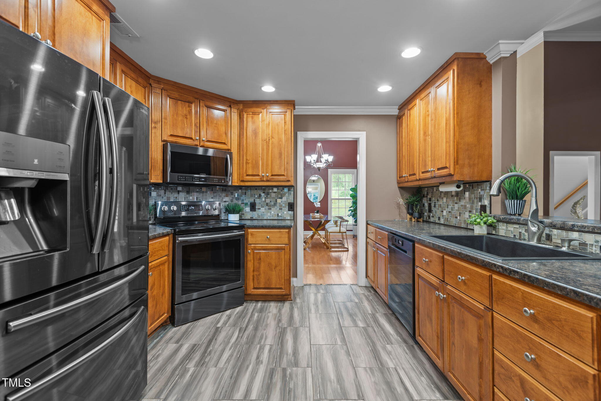 61 Fork Junction Road Timberlake, NC 27583 - Photo 18 of 59 a kitchen with stainless steel appliances a refrigerator sink and stove