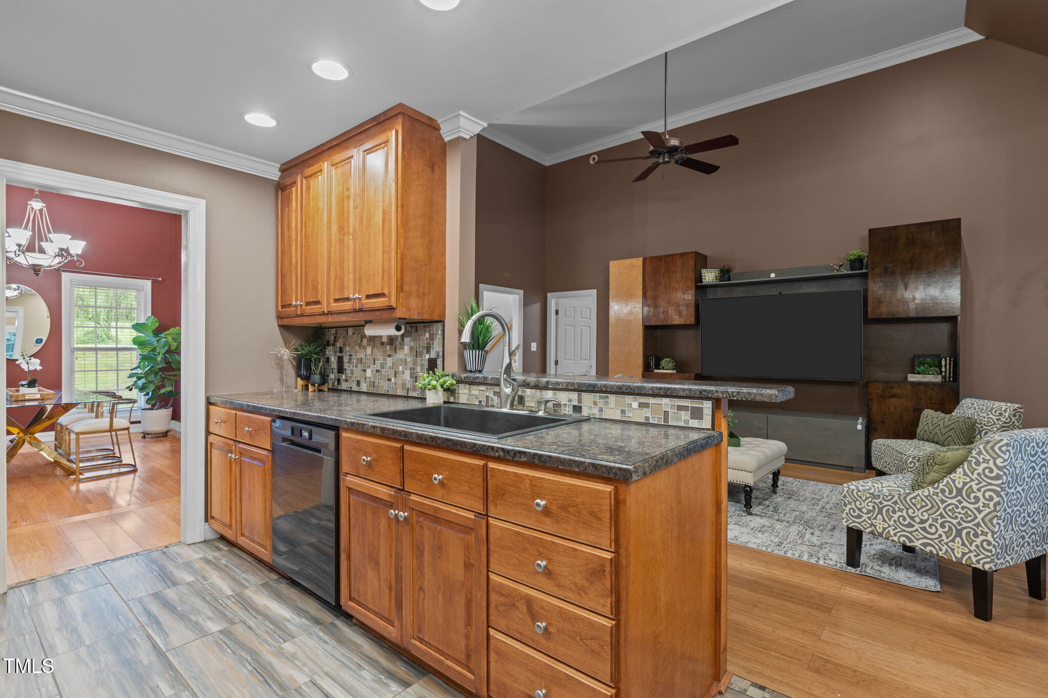 61 Fork Junction Road Timberlake, NC 27583 - Photo 19 of 59 a kitchen with stainless steel appliances granite countertop a sink dishwasher stove and wooden cabinets