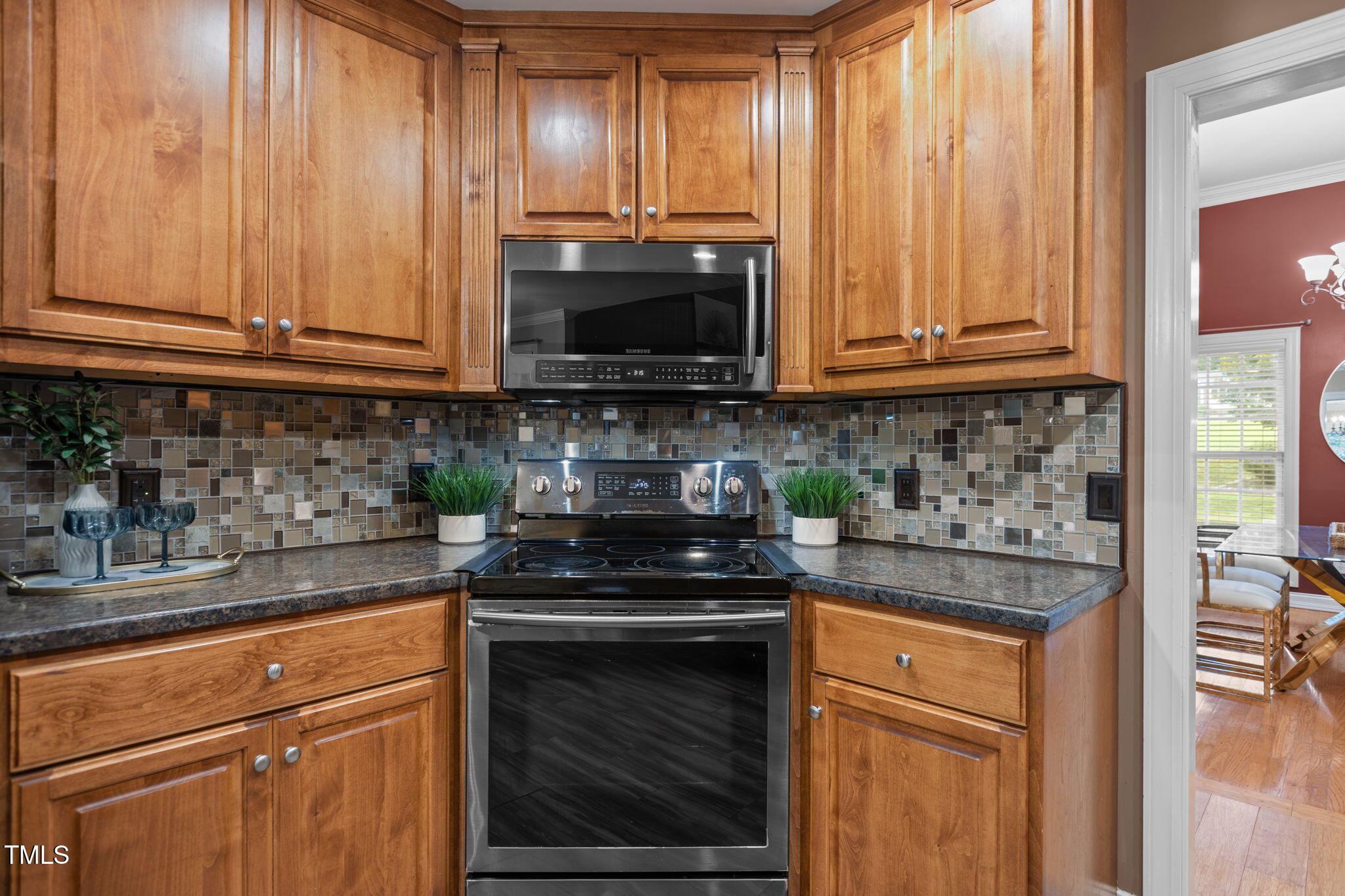 61 Fork Junction Road Timberlake, NC 27583 - Photo 20 of 59 a kitchen with granite countertop a stove a sink and a microwave