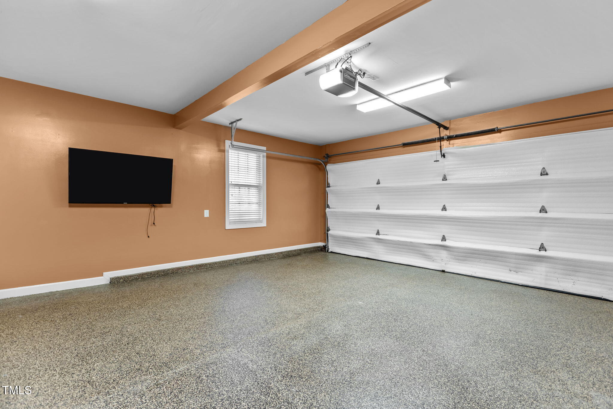 61 Fork Junction Road Timberlake, NC 27583 - Photo 38 of 59 a view of an empty room with a flat screen tv