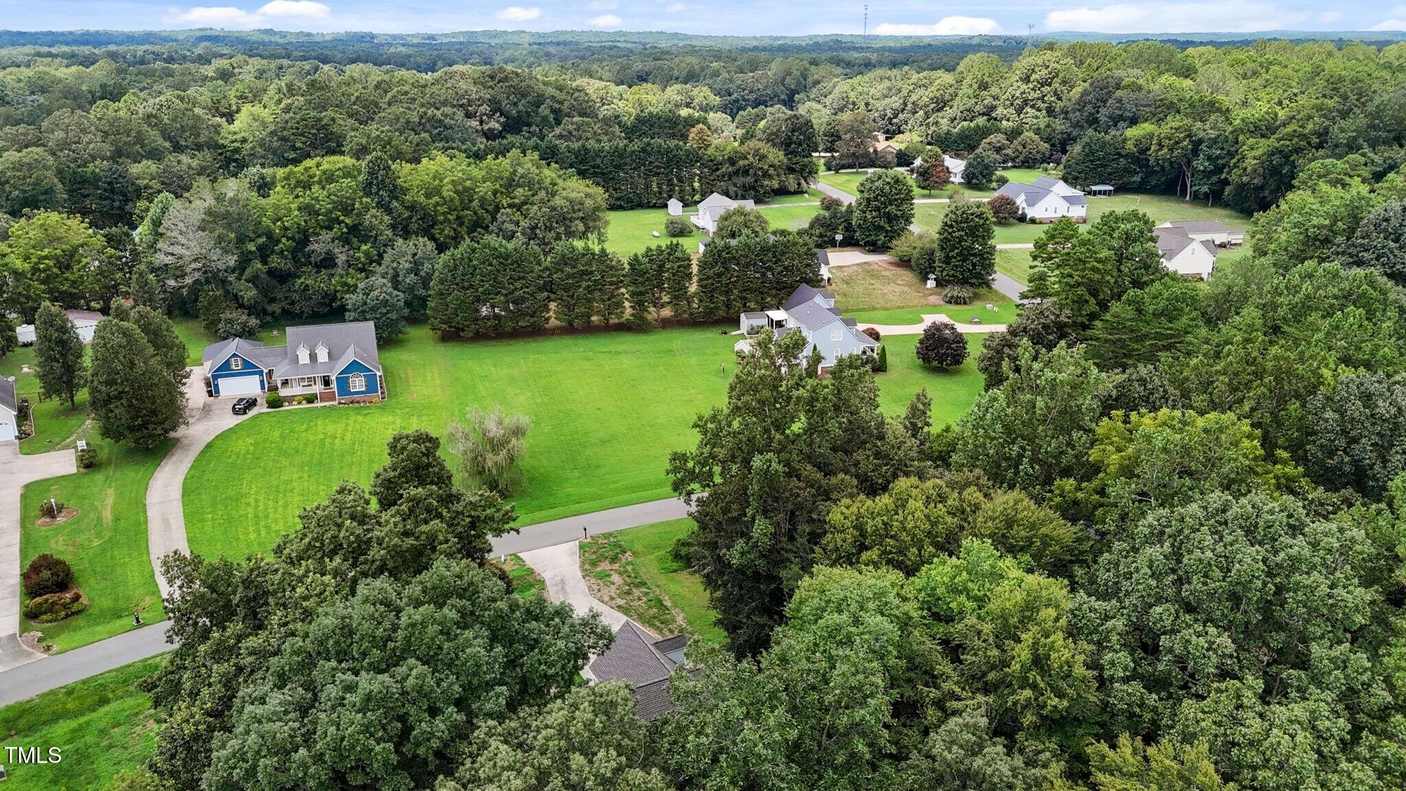 61 Fork Junction Road Timberlake, NC 27583 - Photo 48 of 59 an aerial view of residential houses with outdoor space and trees