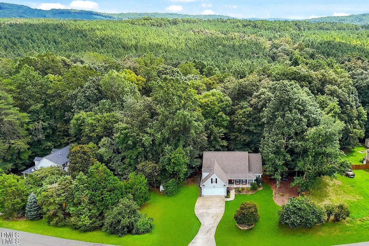 61 Fork Junction Road Timberlake, NC 27583 - Photo 5 of 59 an aerial view of a house with swimming pool and garden