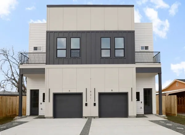 a front view of a building with large windows
