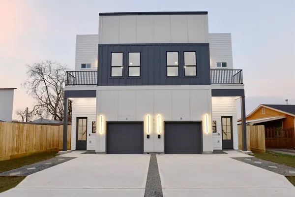 a front view of a house with a garage