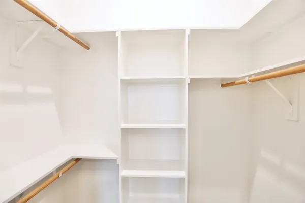 a view of an empty walk in closet