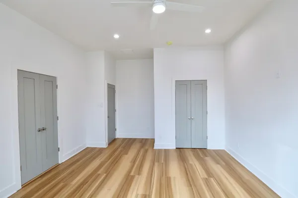 a view of a room with wooden floor and closet