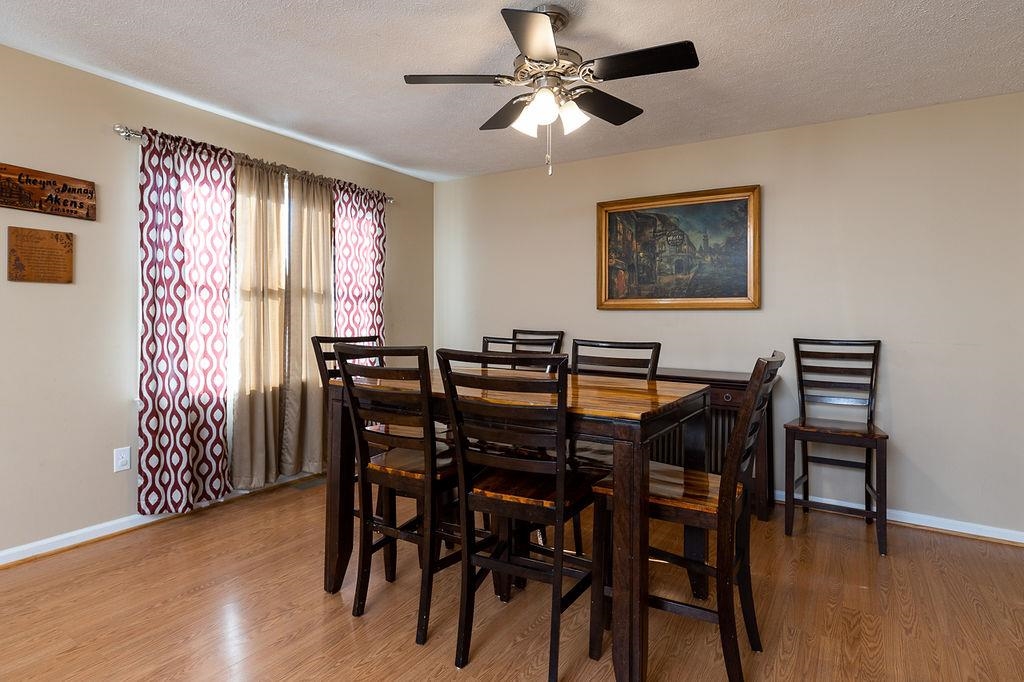 94 Buckboard Road Waynesboro, VA 22980 - Photo 11 of 33 a view of a dining room with furniture window and wooden floor