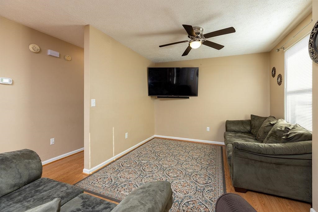 94 Buckboard Road Waynesboro, VA 22980 - Photo 3 of 33 a living room with furniture and a flat screen tv