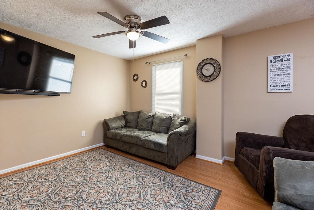 94 Buckboard Road Waynesboro, VA 22980 - Photo 10 of 33 a living room with furniture and a flat screen tv