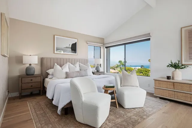 a bedroom with a bed and a couch