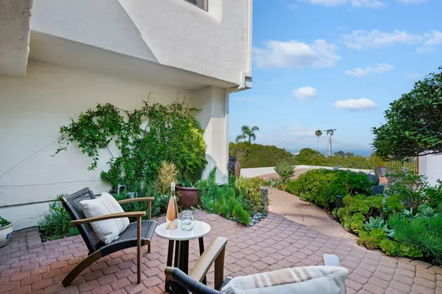a view of a patio with furniture