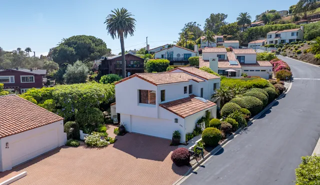 a aerial view of a house with outdoor space