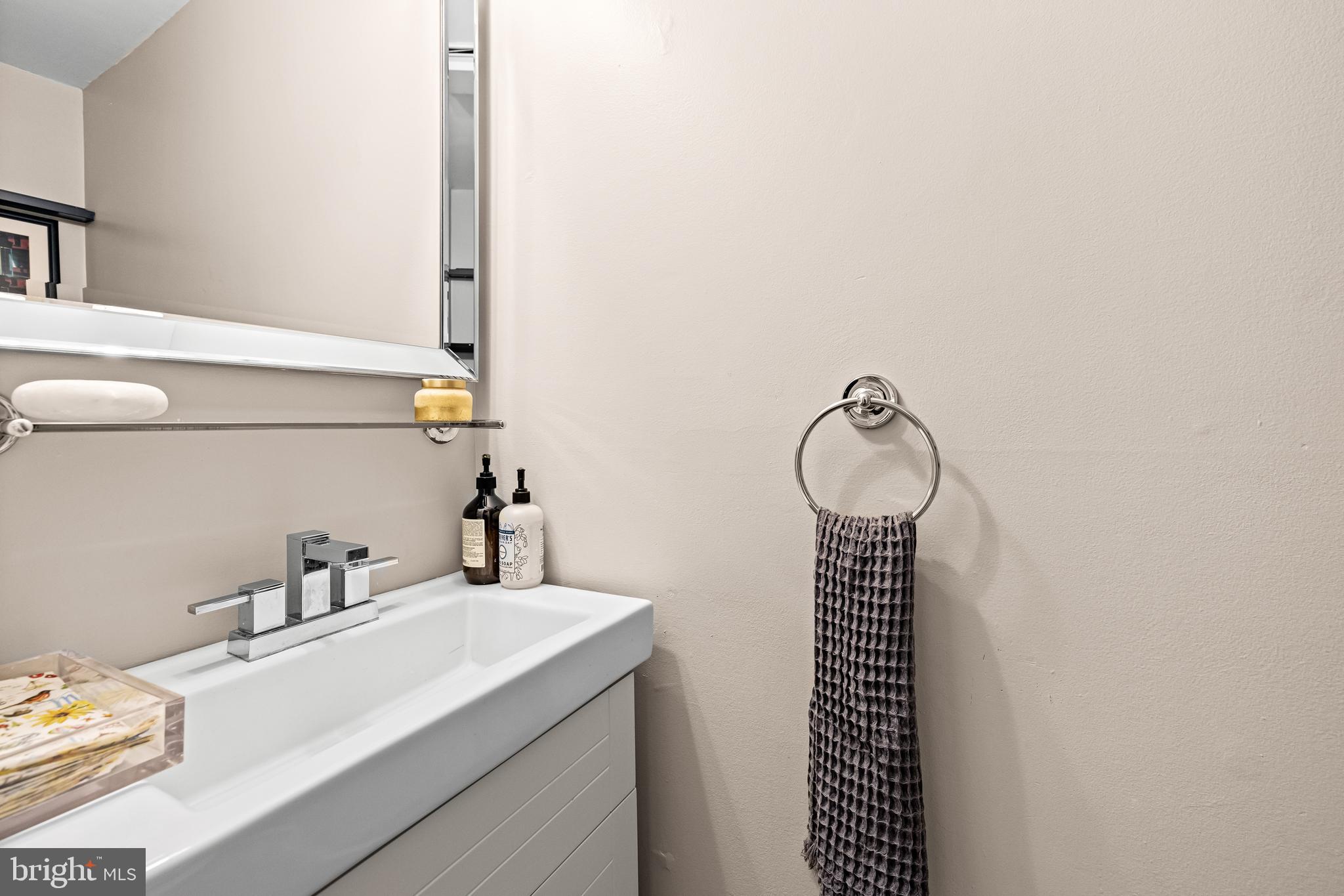 1846 Circle Road Baltimore, MD 21204 - Photo 30 of 62 a bathroom with a sink and a mirror