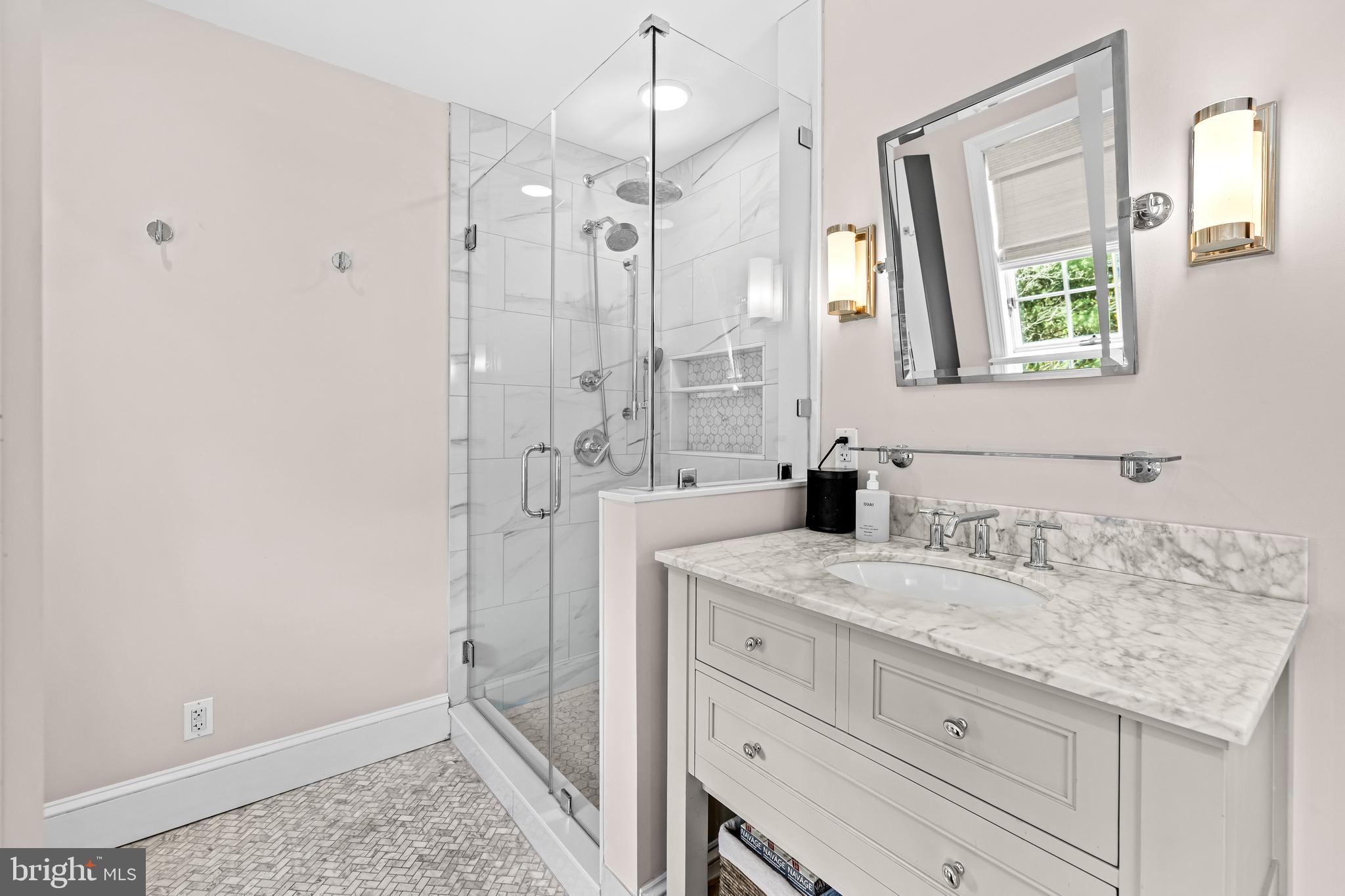 1846 Circle Road Baltimore, MD 21204 - Photo 38 of 62 a bathroom with a granite countertop sink a mirror and shower