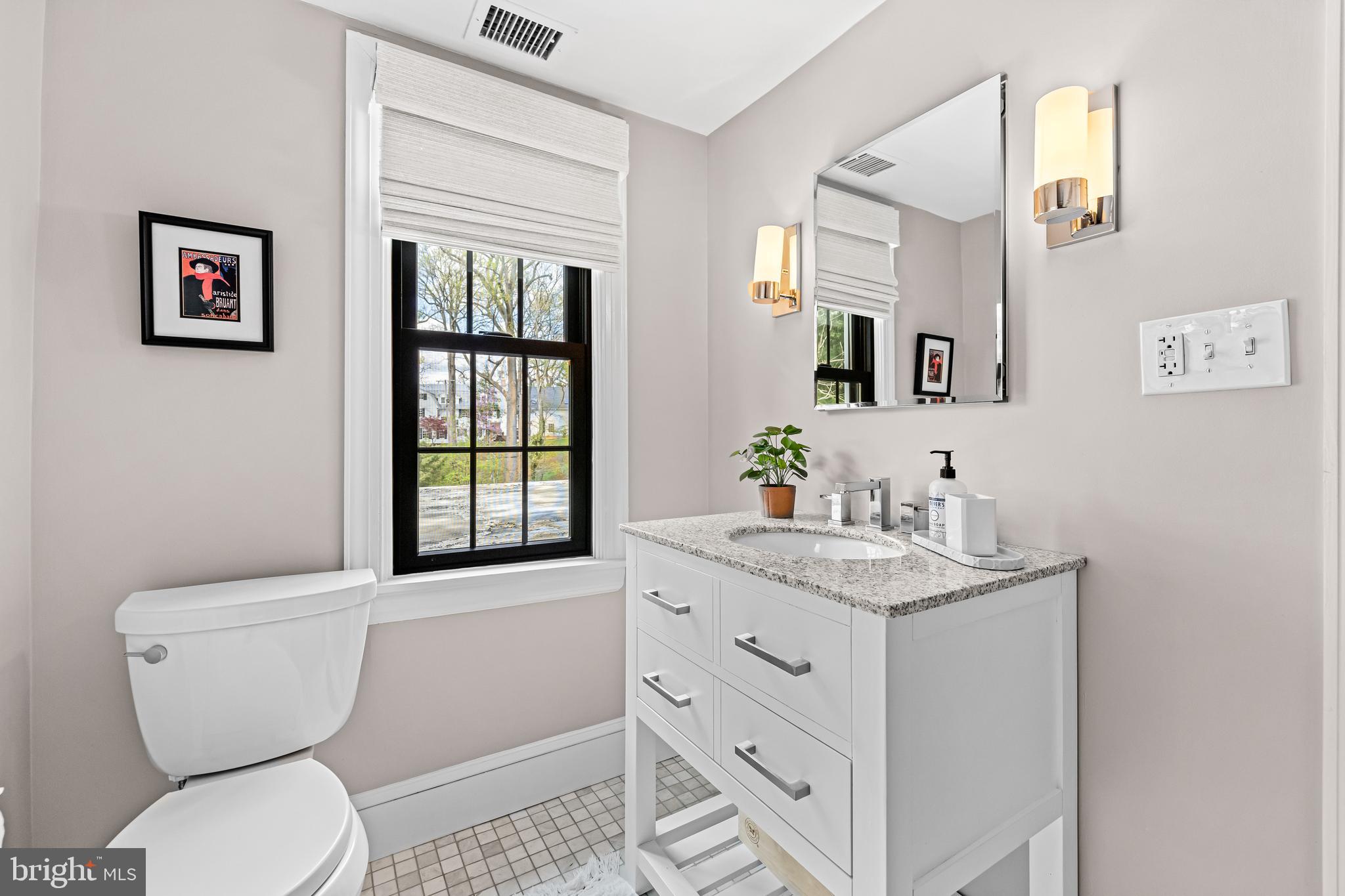 1846 Circle Road Baltimore, MD 21204 - Photo 46 of 62 a bathroom with a toilet sink and mirror