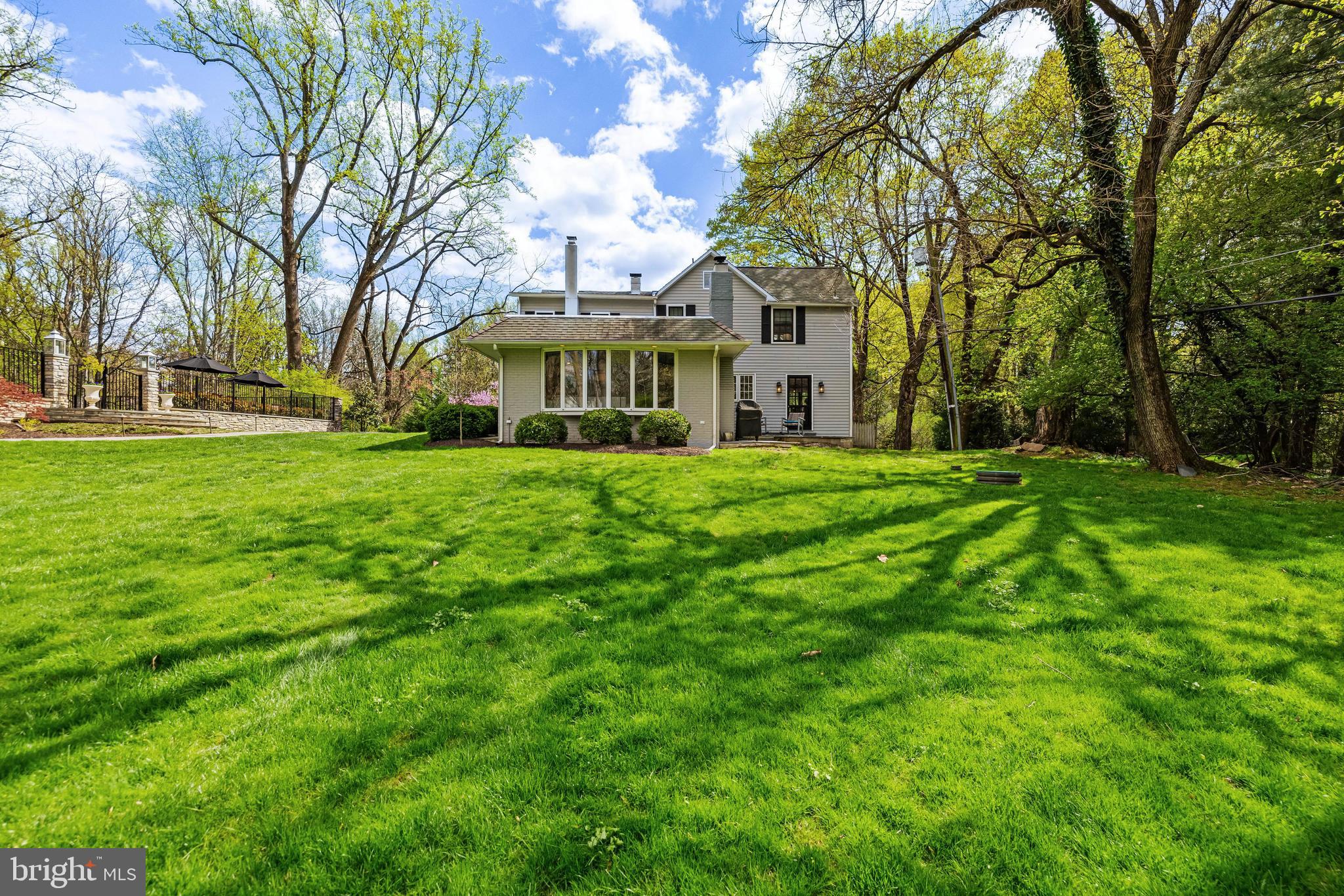 1846 Circle Road Baltimore, MD 21204 - Photo 59 of 62 a view of a white house in front of a big yard with large trees
