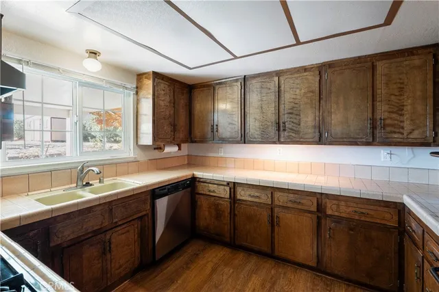 a kitchen with a sink and cabinets