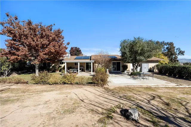 a view of a house with snow in front of it