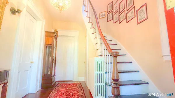 a view of entryway with a front door