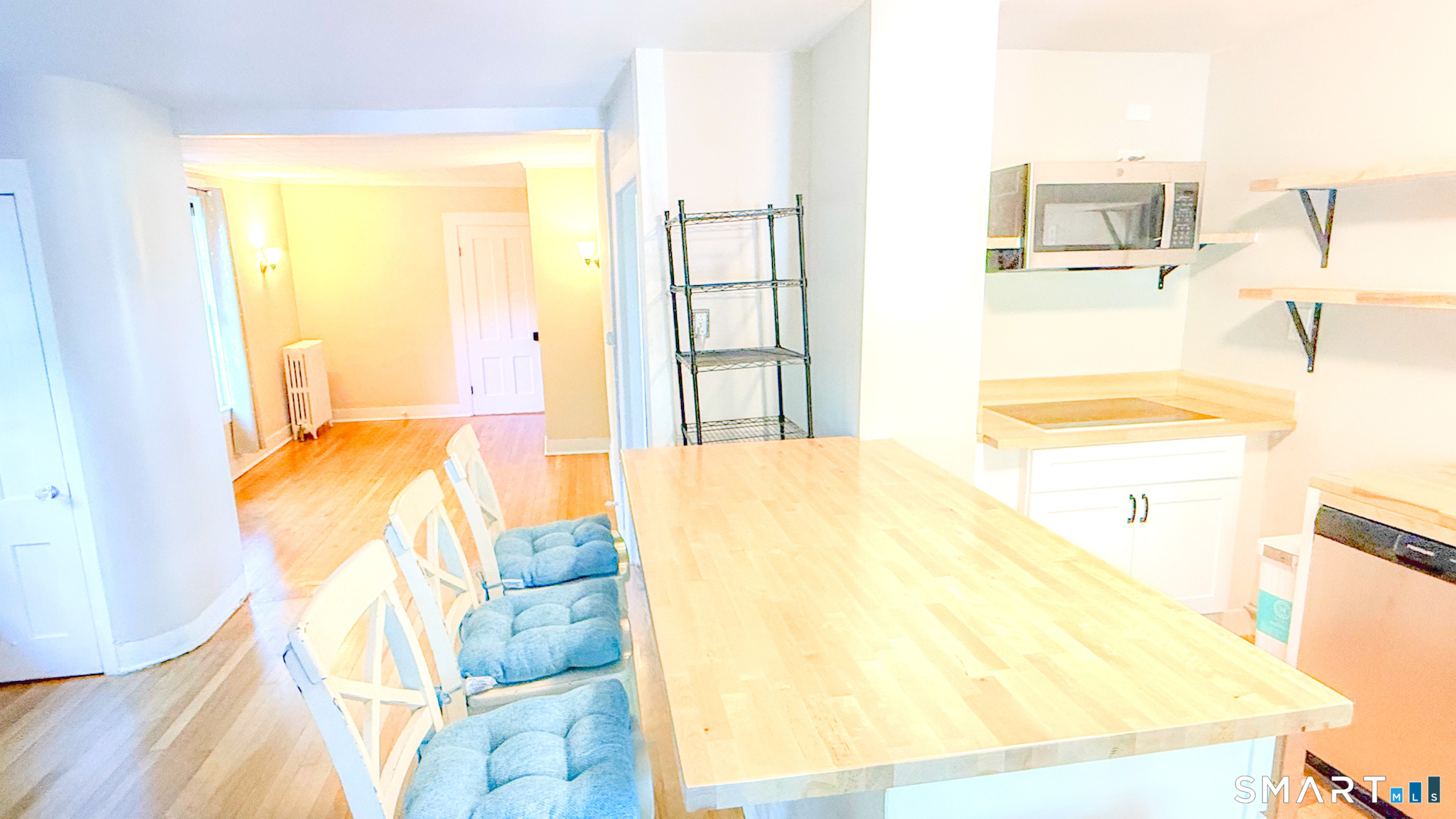 34 Hamilton Avenue Watertown, CT 06795 - Photo 12 of 17 a bedroom with a bed and wooden floor