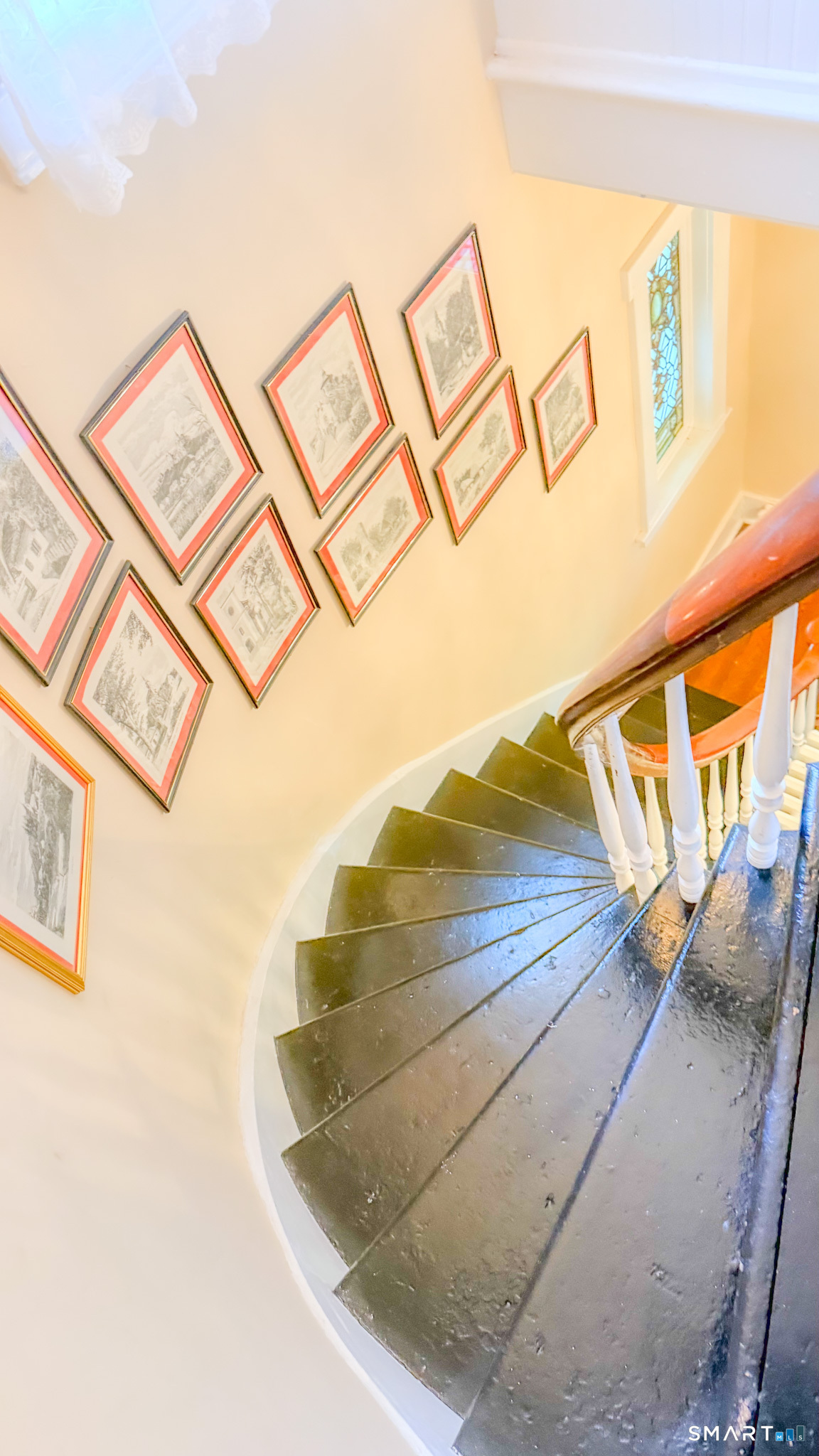 34 Hamilton Avenue Watertown, CT 06795 - Photo 13 of 17 a view of staircase with white walls and a painting on the wall