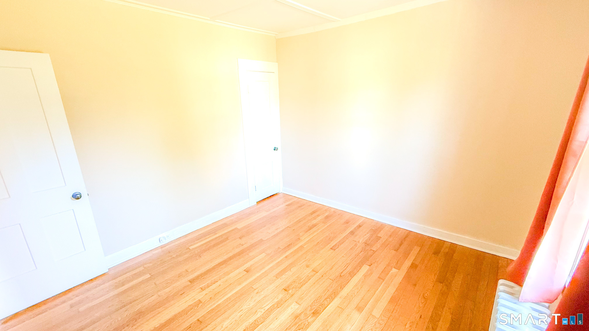 34 Hamilton Avenue Watertown, CT 06795 - Photo 14 of 17 a view of white wall and a wooden floor
