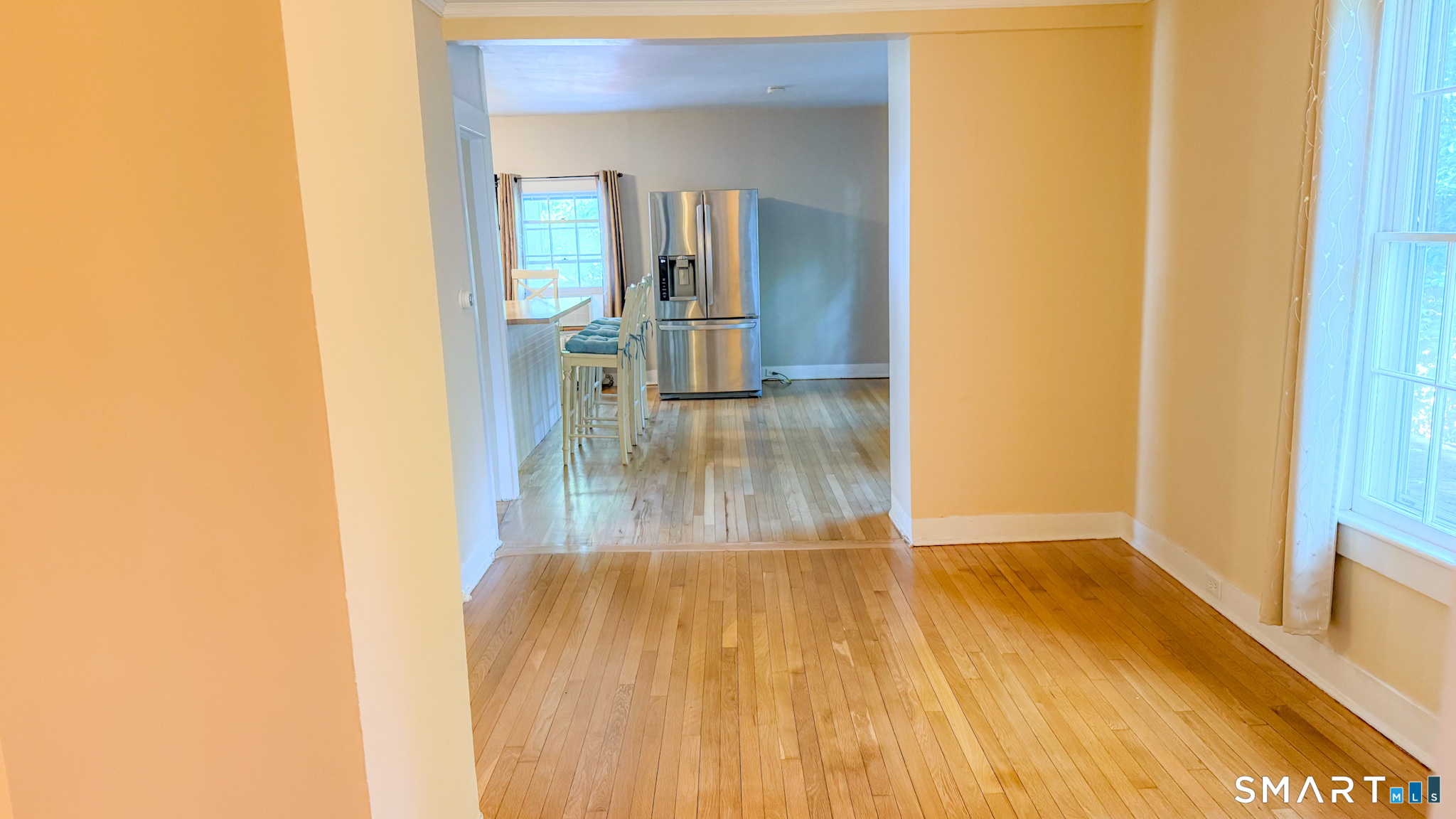 34 Hamilton Avenue Watertown, CT 06795 - Photo 14 of 17 a view of a hallway with wooden floor