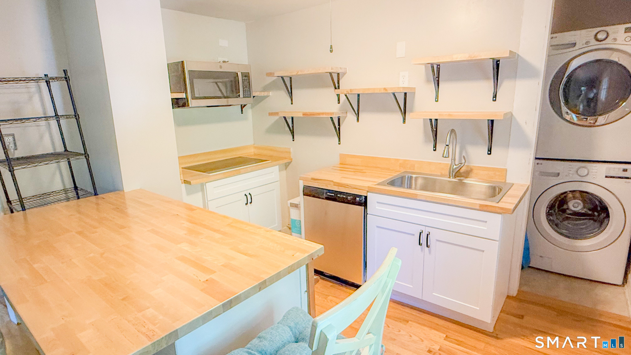 34 Hamilton Avenue Watertown, CT 06795 - Photo 16 of 17 a kitchen with a sink a stove and cabinets