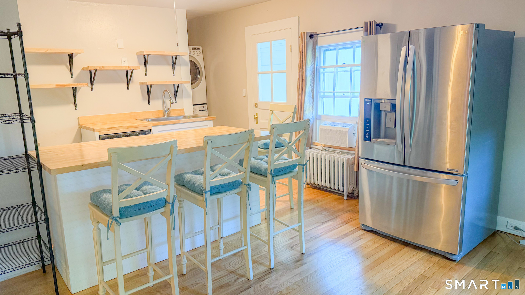 34 Hamilton Avenue Watertown, CT 06795 - Photo 10 of 17 a kitchen with stainless steel appliances granite countertop a refrigerator and a stove top oven