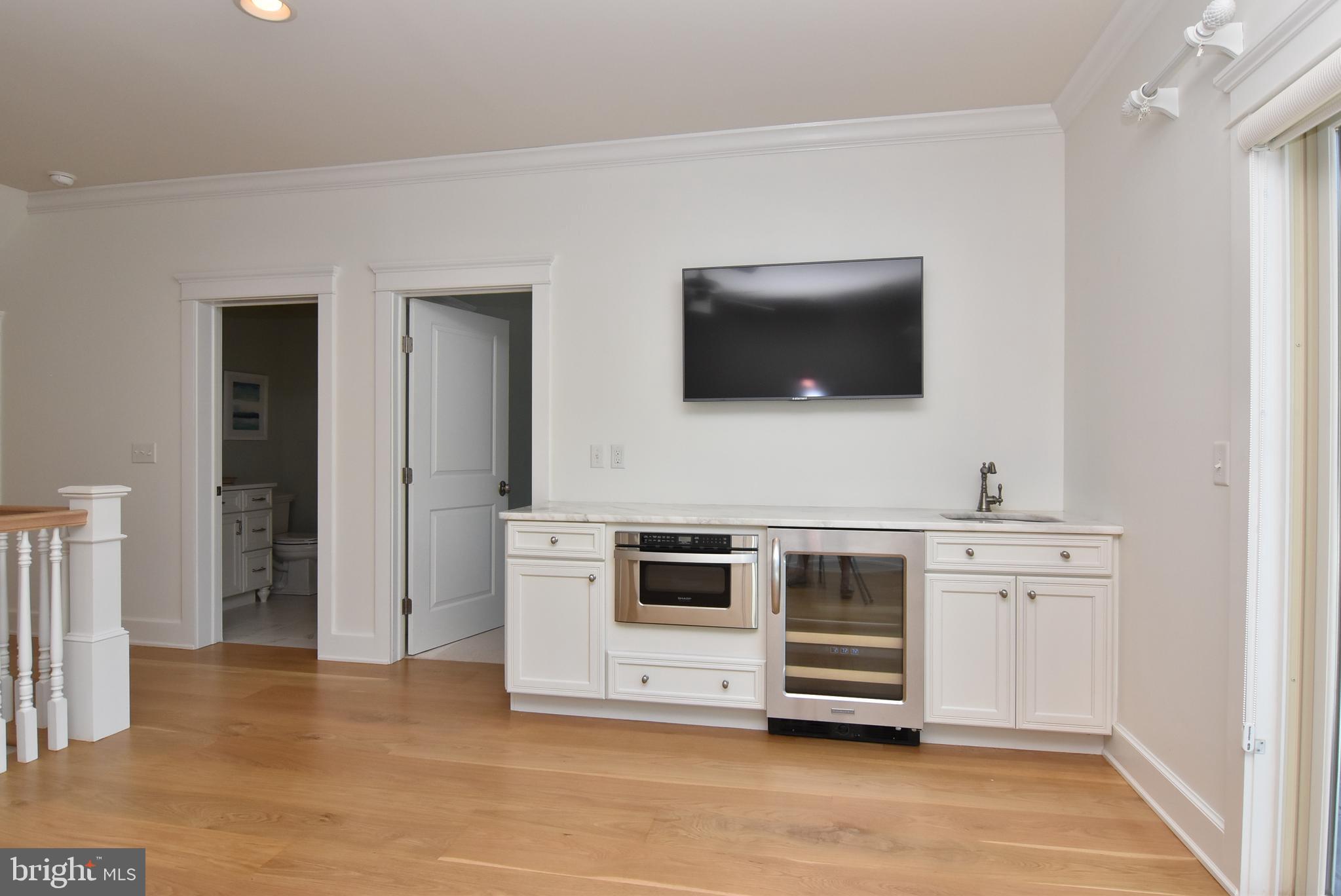 35566 Peregrine Road Lewes, DE 19958 - Photo 43 of 78 UPSTAIRS LOFT WITH FLAT SCREEN TV AND BAR