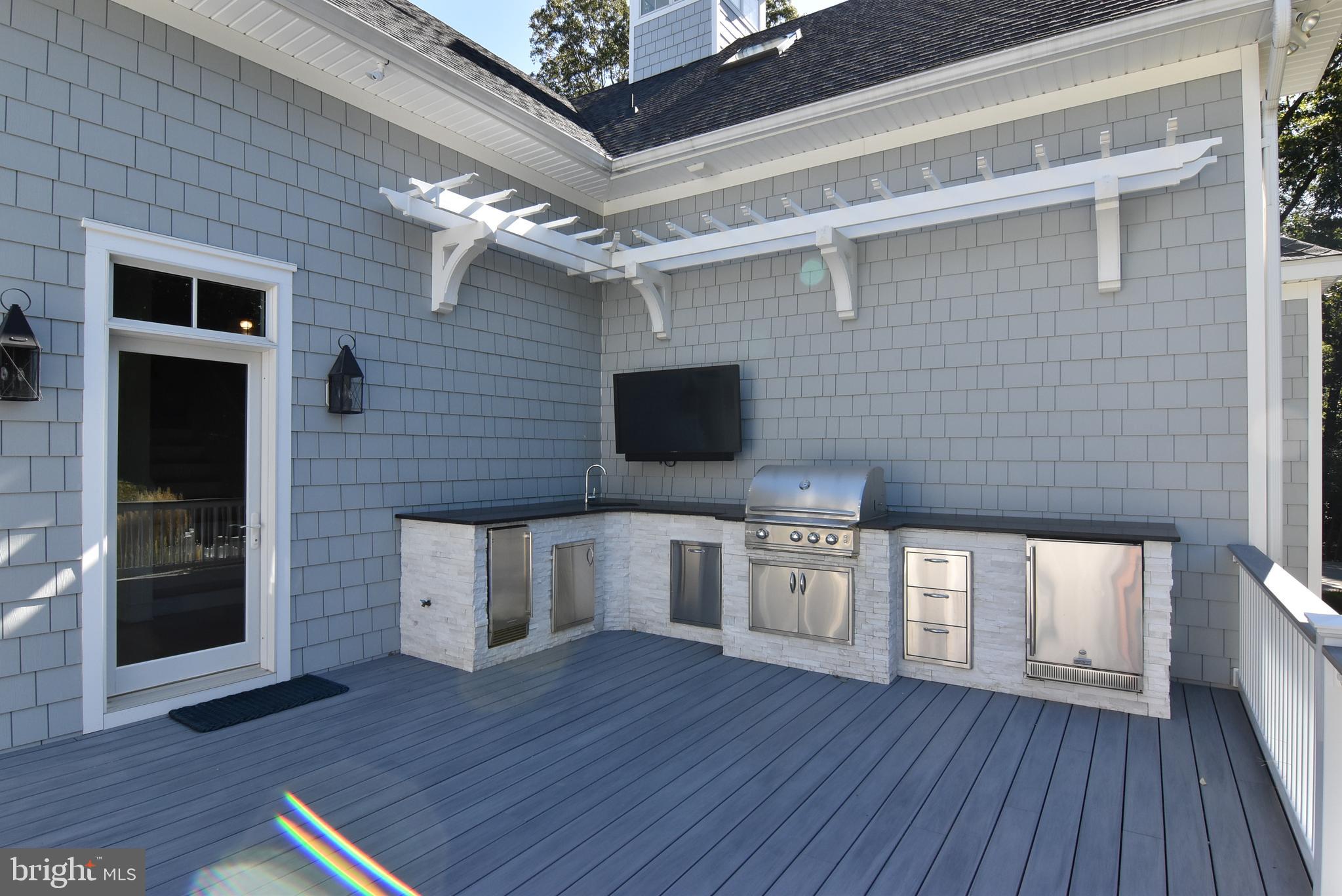 35566 Peregrine Road Lewes, DE 19958 - Photo 56 of 78 Outdoor Kitchen and TV